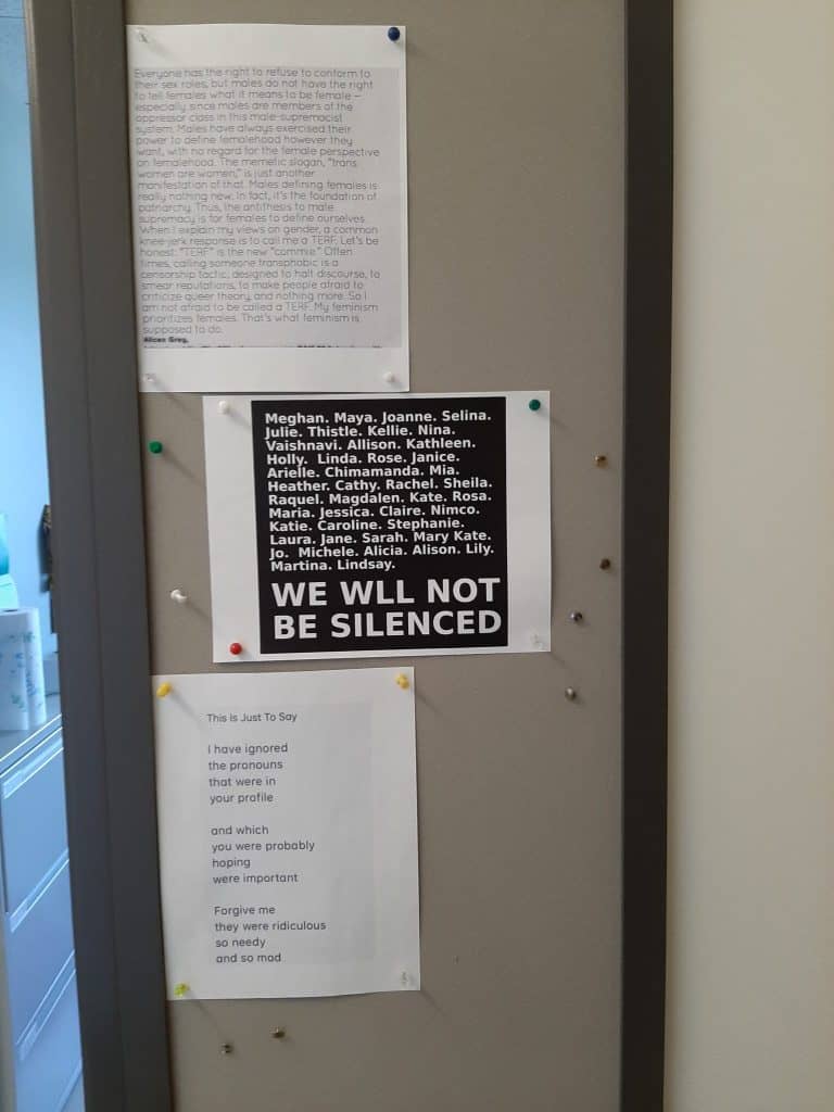 image of bulletin board beside an office door containing several printed sheets of paper
