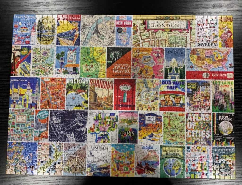 A completed puzzle of what seem to be old travel posters or book covers.